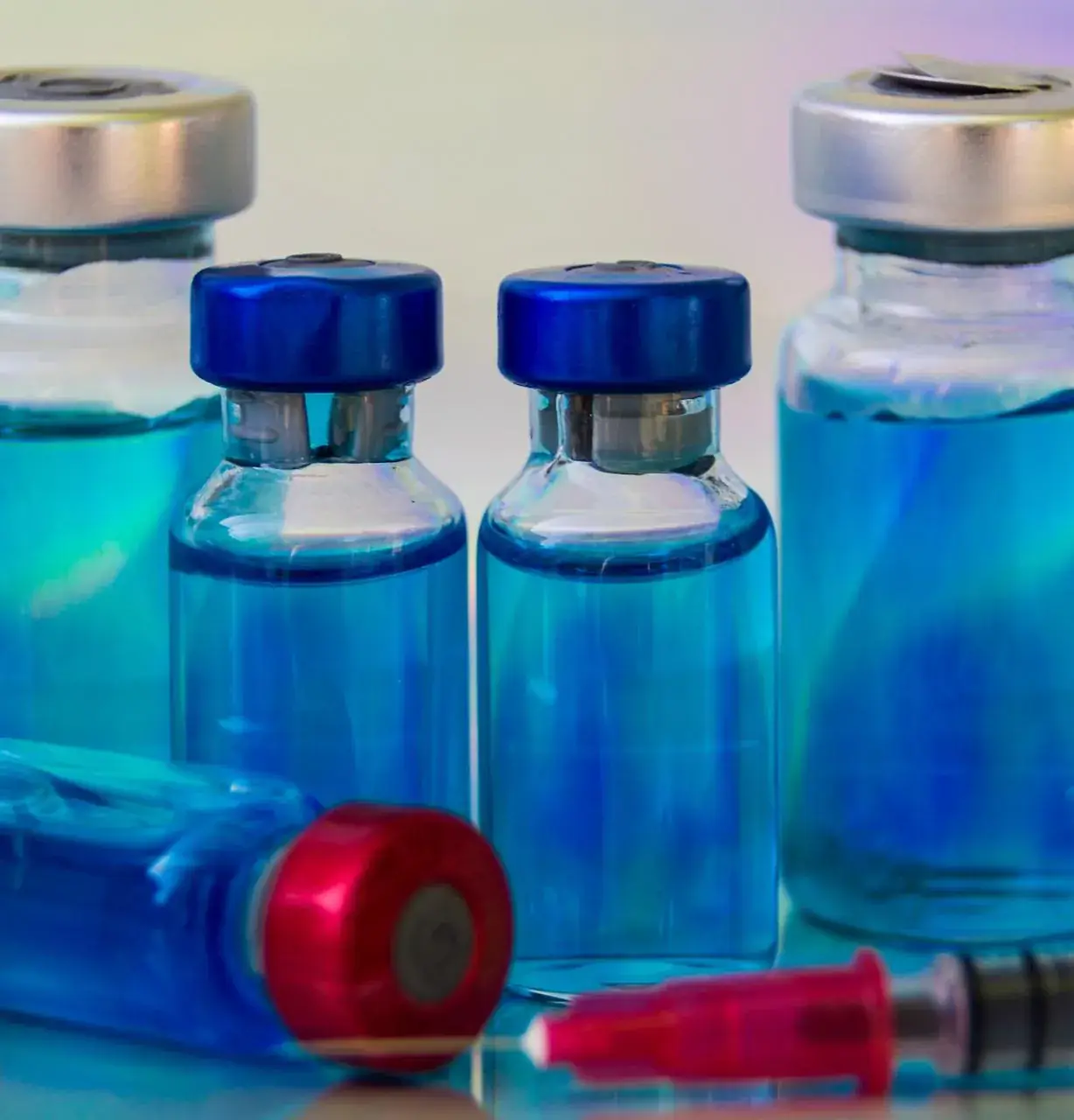 Blue peptide vials representing physician-guided peptide wellness protocols
